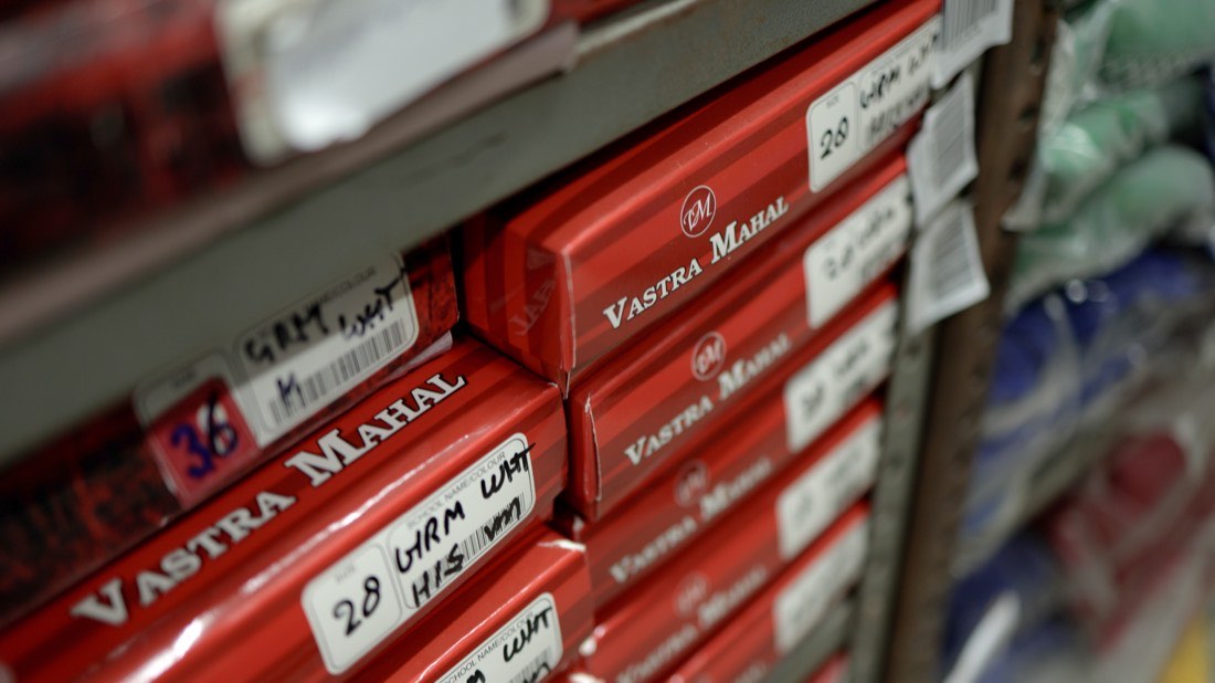 Shelves of boxed garments carrying the Vastra Mahal label